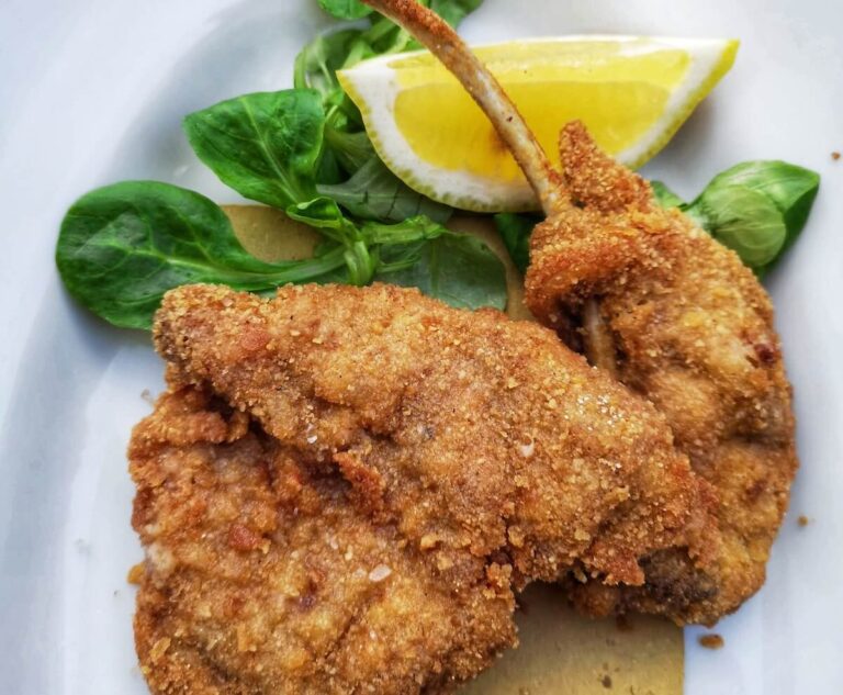 Plate of breaded lamb cutlets scottaditto in a restaurant in Frascati Italy