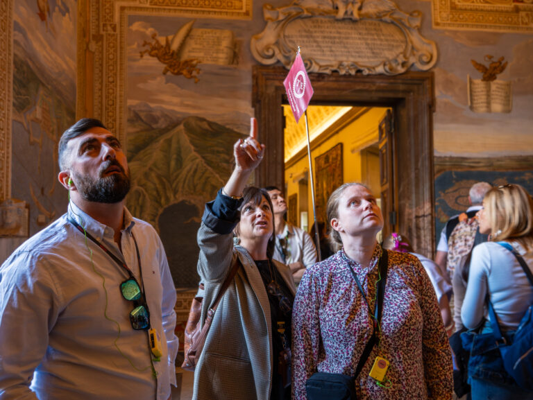 Gracelyn guides a group around the Vatican Museums on a Through Eternity tour